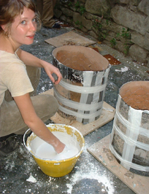 These flasks are made of tarpaper, taped into a roll, with a plywood base.