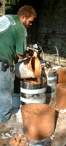 Each batch of investment is mixed in 5-gallon buckets, and must be added to the flask before the previous one sets up.