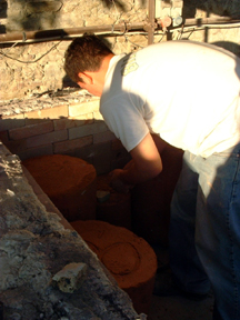 The molds are set on blocks and slightly away from each other to leave a convection-space within the kiln.