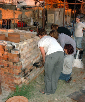 The investments are set into the kiln with the open end down, so the wax will run out as it melts.