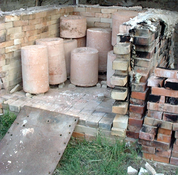 View of the kiln as it is being unloaded the next morning.